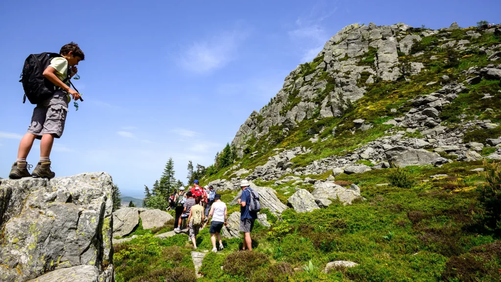 Family or group hiking at the Mont-Gerbier-de-Jonc, in spring