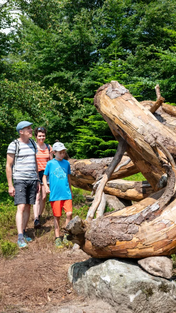 Family looking at the watershed work “Ouroboros”