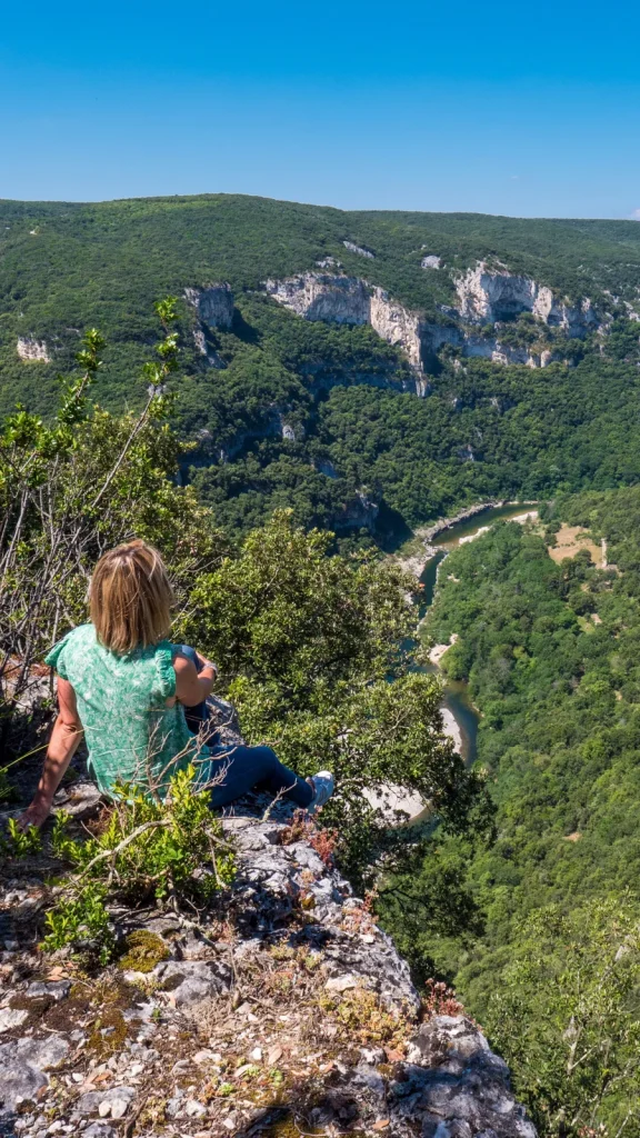 Woman observing the Ardèche Gorges in summer