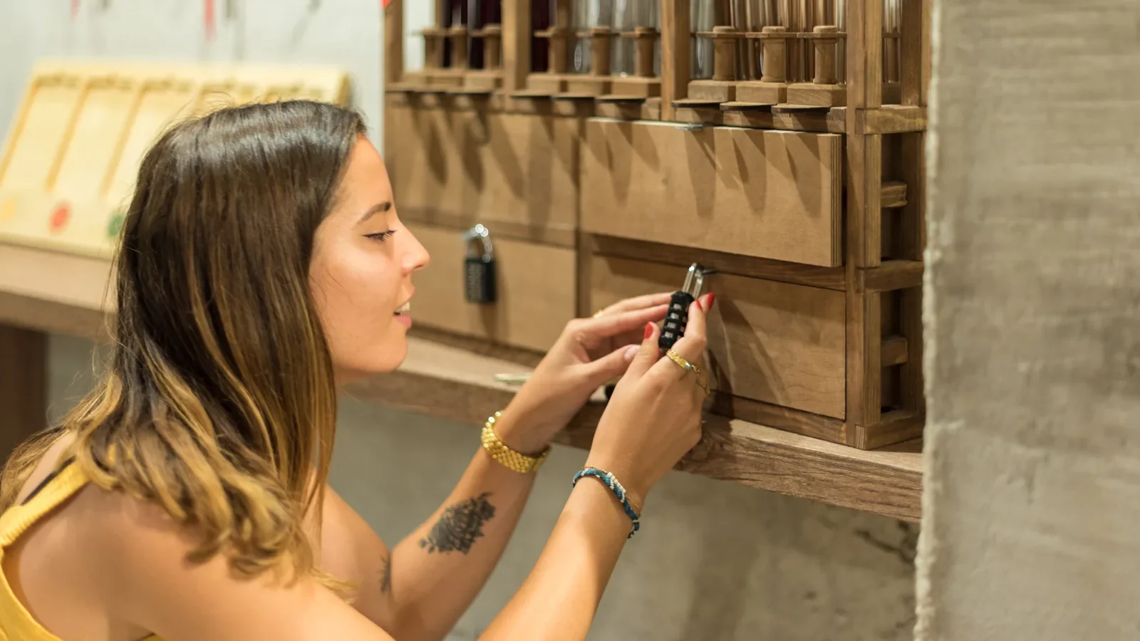 Woman playing at the escape game of the "Mas d’Intras" : “Wine Gaming”